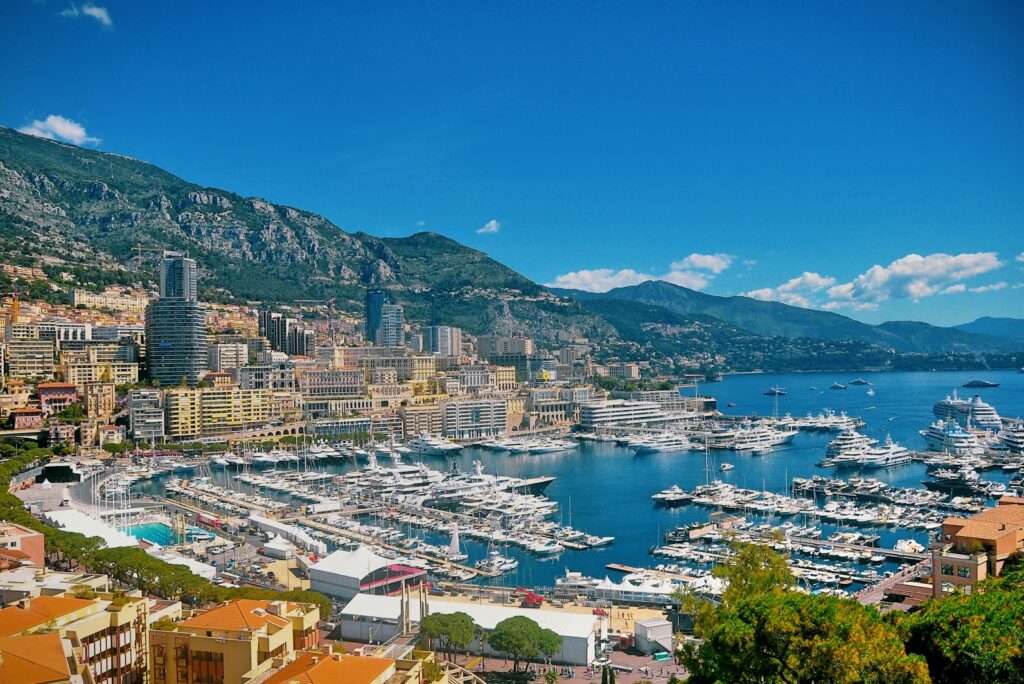 View of Monaco harbour with yachts below the hillside