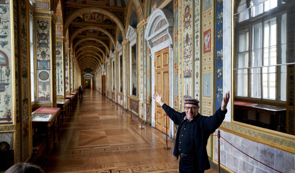 Private guide welcoming visitors in a gilded museum gallery on exclusive family holidays with DaDa Kids