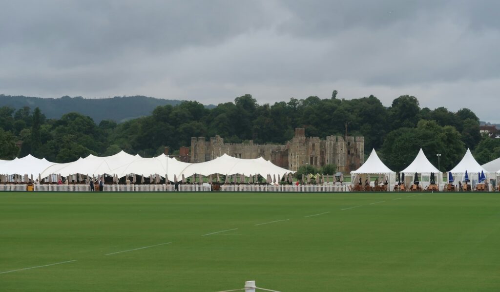 Exclusive event access — guests arriving at a private enclosure at a summer race meeting
