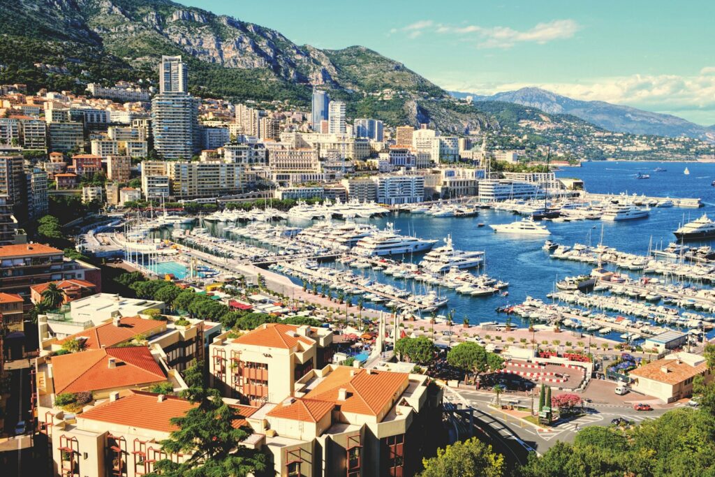 Aerial view of Port Hercule and the Monaco harbour against the mountains