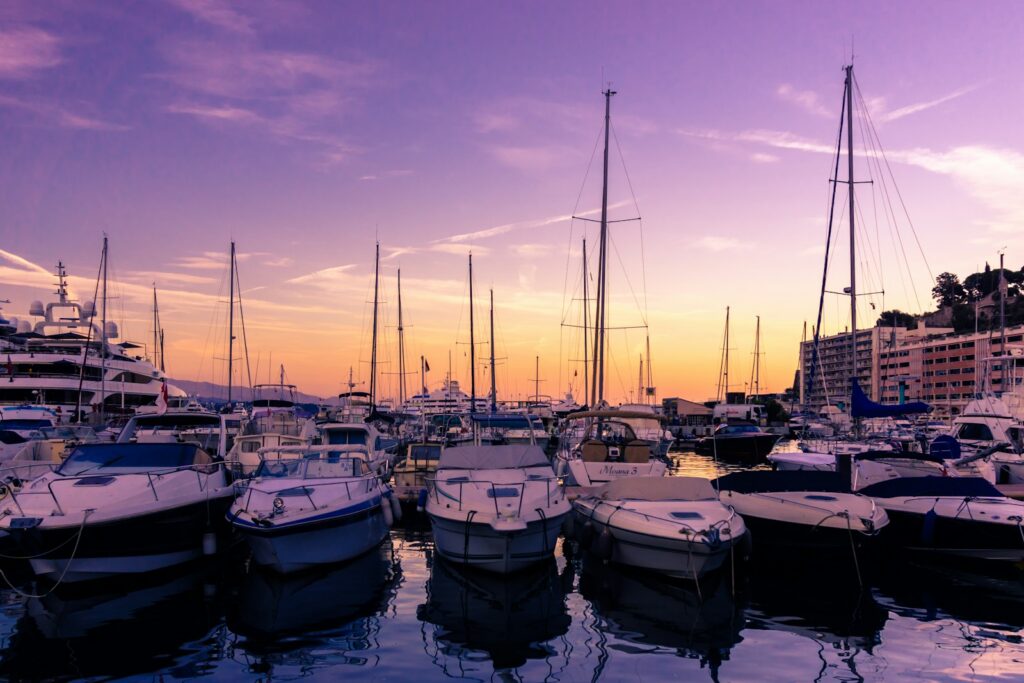 Yachts moored in Port Hercule at sunset