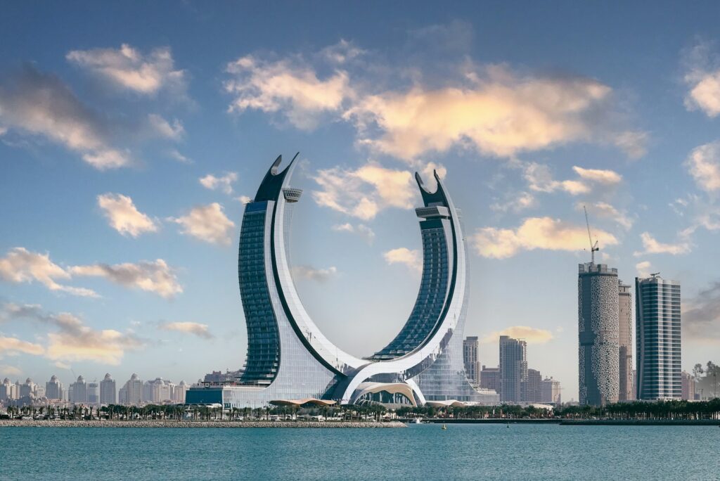 Katara Towers at Lusail Marina on the Qatari coast under a late-afternoon sky