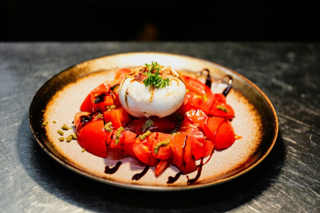 Burrata with tomatoes, a signature Niçoise-style sharing dish