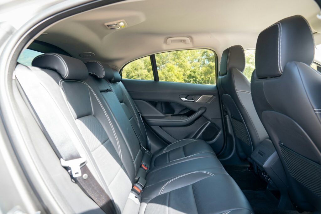 A quiet leather back seat in a modern luxury saloon