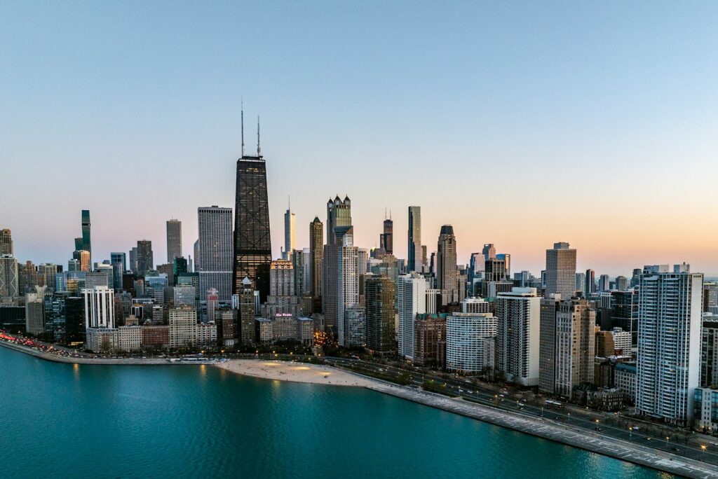 Aerial view of the Chicago skyline and Lake Michigan shoreline at dusk