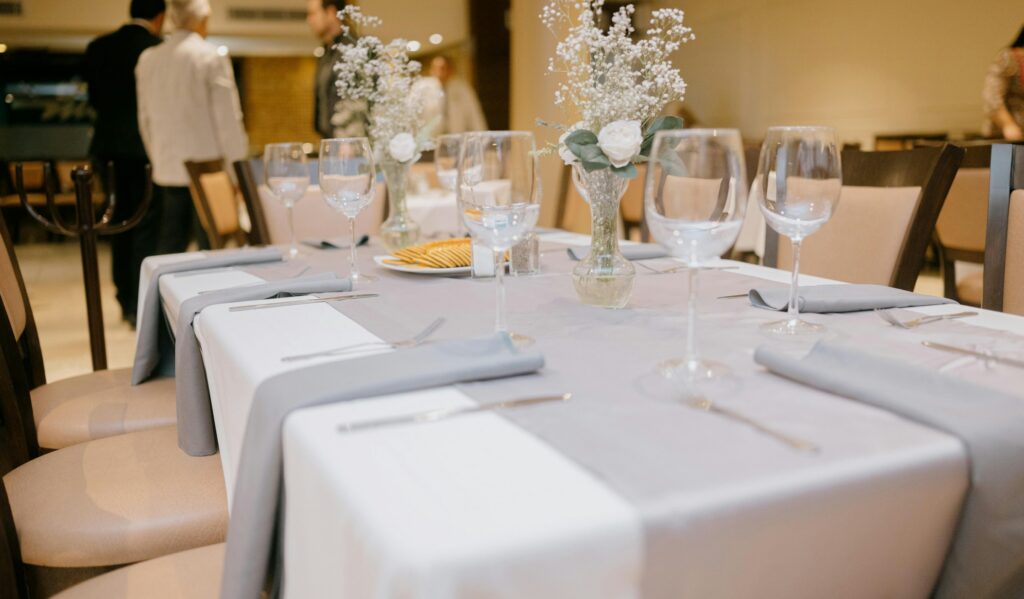 Formal dining table laid with glassware and linen, the setting of Michelin star restaurants Las Vegas