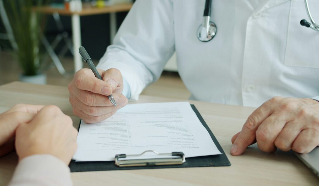 NAD IV therapy consultation: a physician reviewing a patient's history before any infusion