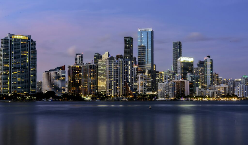 Downtown Miami skyline across Biscayne Bay at dusk, the setting for New Year's Eve Miami