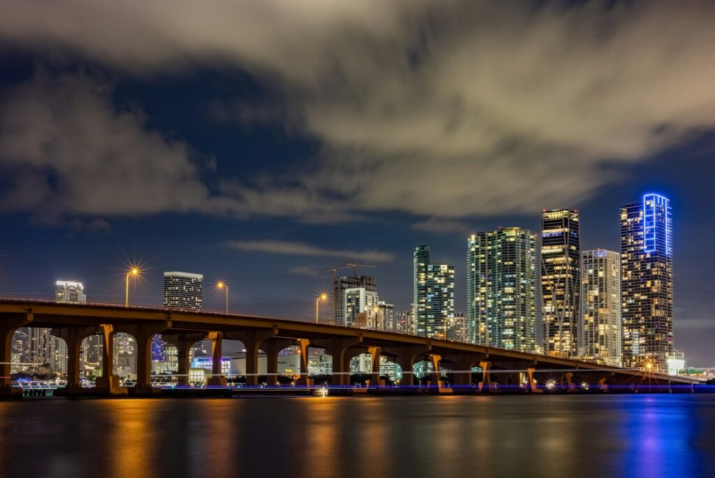 Night skyline of Miami Beach reflected in the bay