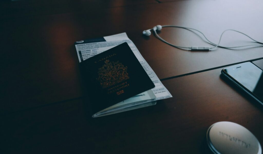 Smartphone banking app beside travel plans, personal assistance in fintech | Perfect.Live