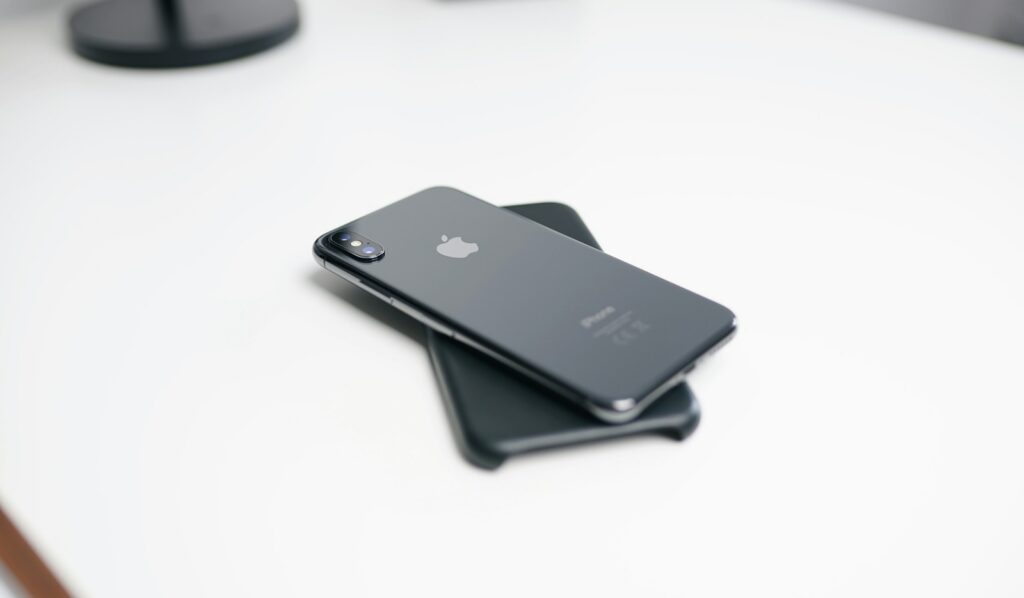 Personal concierge vs corporate concierge — two phones stacked on a desk