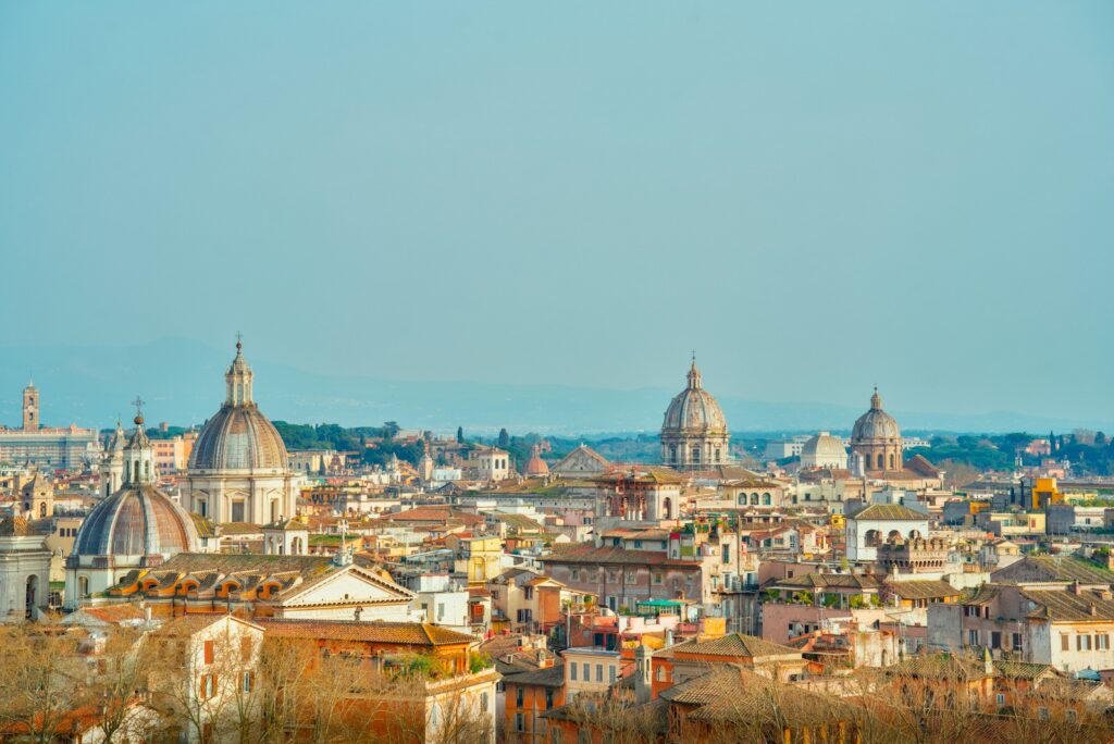 Rooftops and church domes of Rome seen from a high terrace
