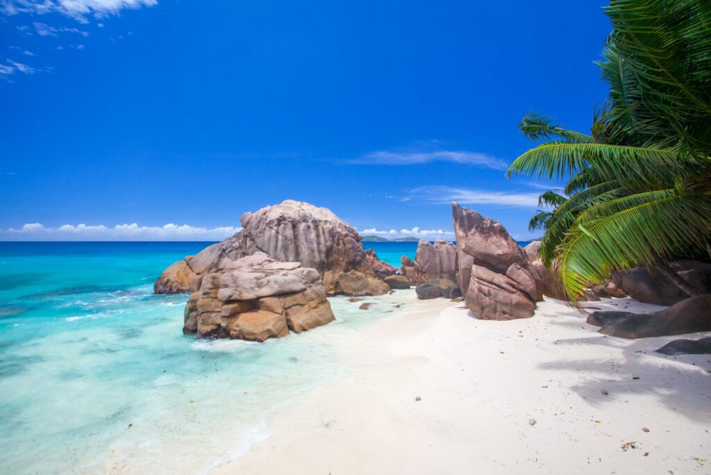 Granite boulders and white sand on a Seychelles beach