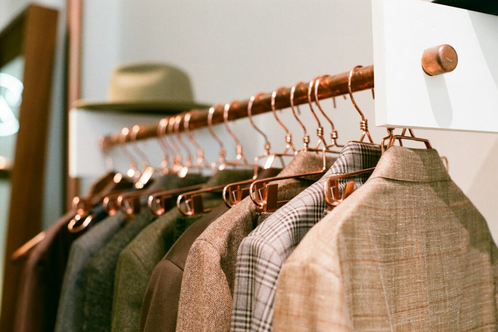 Tailored jackets on a boutique rack ready for a private appointment