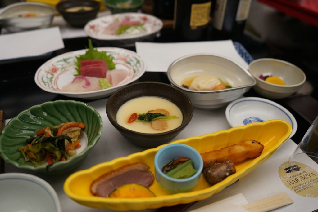 Kaiseki-style multi-course meal served in small porcelain dishes