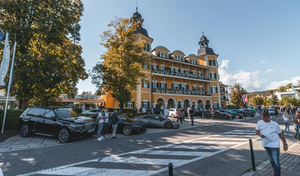 Travel concierge — black cars outside a classic hotel in a European city